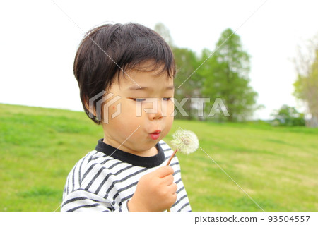 A boy playing in a park A boy playing in a park 93504557