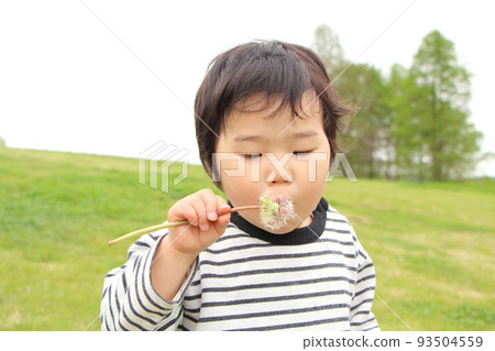 A boy playing in a park A boy playing in a park 93504559