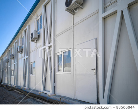 Prefabricated office container building at construction site Prefabricated office container building at construction site 93506044