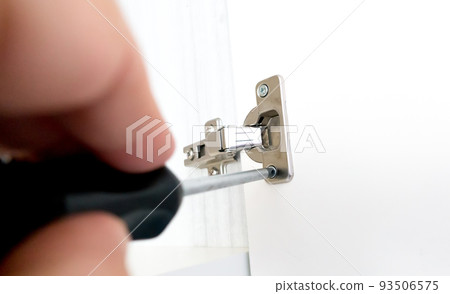 Repairman install cabinet hinge Repairman install cabinet hinge 93506575