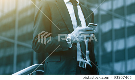 Success business man using cell phone. Blue Toned Image. 93507405