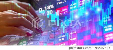 Trader at home working on laptop analyzing indexes, financial chart, graphs, investment and online trading 93507423