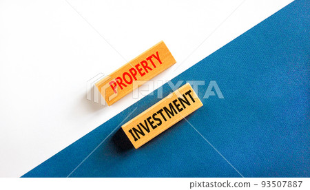 Property investment symbol. Concept words Property investment on wooden blocks on a beautiful white and blue background. Business Property investment concept. Copy space. Property investment symbol. Concept words Property investment on wooden blocks on a beautiful white and blue background. Business Property investment concept. Copy space. 93507887