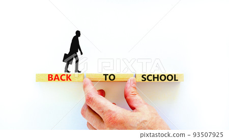 Back to school and support symbol. Concept words Back to school on wooden blocks. Businessman hand. Beautiful white table white background. Business, educational Back to school concept. Copy space. Back to school and support symbol. Concept words Back to school on wooden blocks. Businessman hand. Beautiful white table white background. Business, educational Back to school concept. Copy space. 93507925