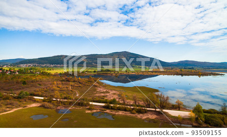 Aerial drone view of amazing autumn colors on the lake. Cerknisko lake, Slovenia 93509155