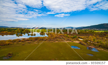 Aerial drone view of amazing autumn colors on the lake. Cerknisko lake, Slovenia Aerial drone view of amazing autumn colors on the lake. Cerknisko lake, Slovenia 93509157