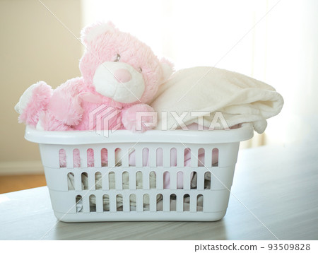 Plastic basket with clean clothes. Plastic basket with clean clothes. 93509828