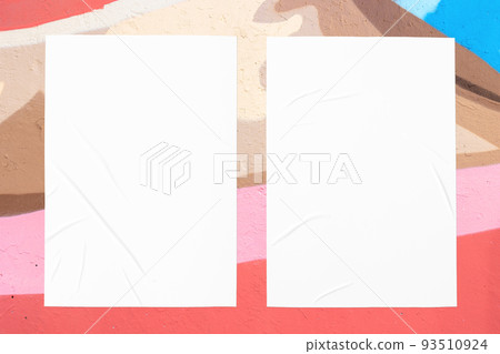colorful urban wall texture with two wrinkled glued poster templates 93510924