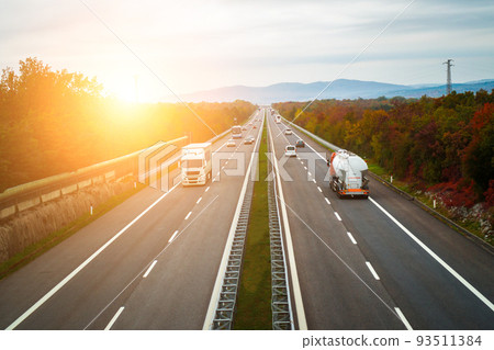 Sunrise on the highway. Transportation and traffic concept. Sunrise on the highway. Transportation and traffic concept. 93511384