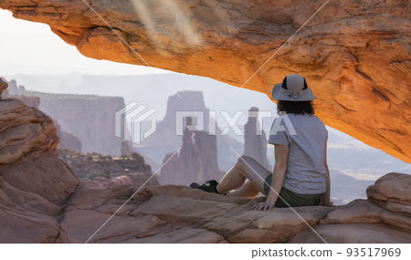 Adventurous Woman at a Scenic American Landscape and Red Rock Mountains 93517969