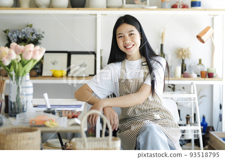 Portrait of confident woman arms crossed smiling at camera. 93518795