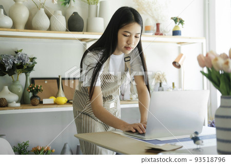 Young businesswoman contact with customers celebrate success. 93518796