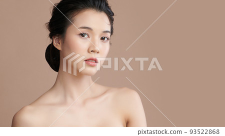 Beautiful young asian woman with clean fresh skin on beige background, Face care, Facial treatment, Cosmetology, beauty and spa, Asian women portrait. Beautiful young asian woman with clean fresh skin on beige background, Face care, Facial treatment, Cosmetology, beauty and spa, Asian women portrait. 93522868