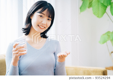 Woman taking medicine 93524294