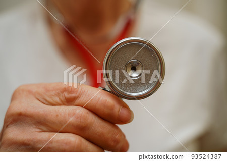 Medical background doctor stethoscope. Happy nurse in hospital uniform, hands with stethoscope isolated on white. Medical care and healthcare concept 93524387
