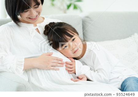 Woman pregnant with second child Woman pregnant with second child 93524649