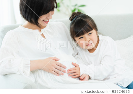 Woman pregnant with second child Woman pregnant with second child 93524655