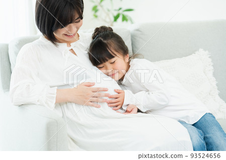 Woman pregnant with second child Woman pregnant with second child 93524656