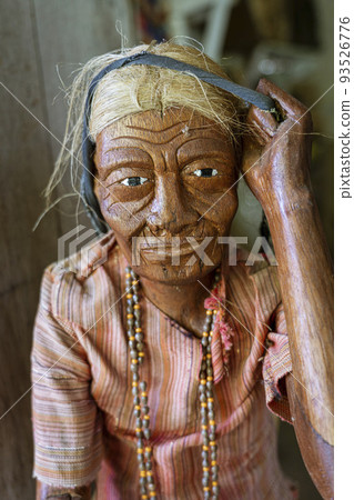 Java, Indonesia, June 13, 2022 - Tau Tau are wooden effigies carved in Toraja to represent people Java, Indonesia, June 13, 2022 - Tau Tau are wooden effigies carved in Toraja to represent people 93526776