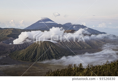 Java, Indonesia, June 13, 2022 - Mount Bromo ejects fumes that are blown across the frame 93526830