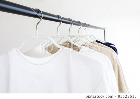 Clothes lined up on a hanger rack Simple image Clothes lined up on a hanger rack Simple image 93528613