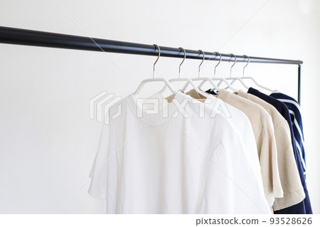 Clothes lined up on a hanger rack Simple image Clothes lined up on a hanger rack Simple image 93528626