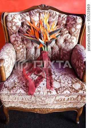 Beautiful wedding bouquet on a pink chair Beautiful wedding bouquet on a pink chair 93528969