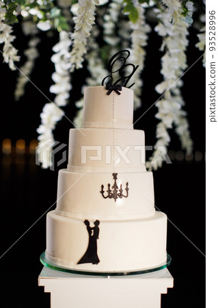 Multilevel wedding cake decorated with colorful flower Multilevel wedding cake decorated with colorful flower 93528996