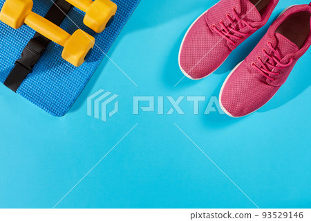 Female sport shoes and equipment top view, copy space. Active lifestyle, body care concept. 93529146