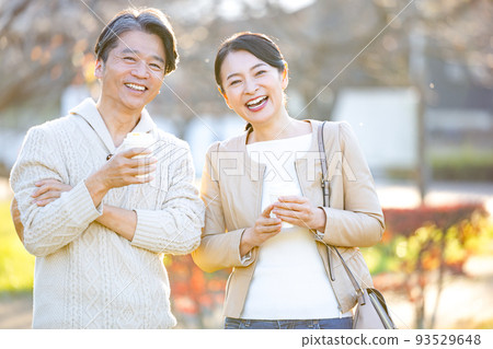 Travel image Middle couple enjoying autumn leaves hunting 93529648