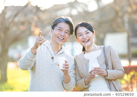 Travel image Middle couple enjoying autumn leaves hunting 93529650