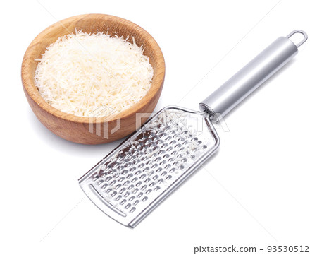 grated Parmesan cheese in wooden bowl and grater isolated on white background 93530512