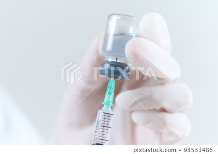 Doctor's hand sucking injection medicine from vial bottle Doctor's hand sucking injection medicine from vial bottle 93531486