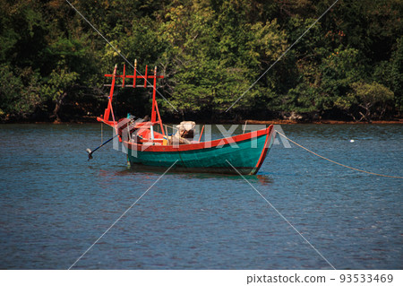 A traditional khmer fishing boat moored off the coast of Koh Tonsay or Rabbit Island in Cambodia A traditional khmer fishing boat moored off the coast of Koh Tonsay or Rabbit Island in Cambodia 93533469