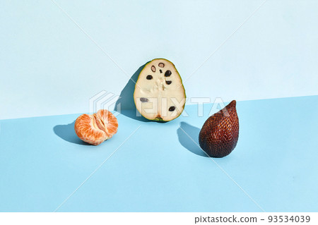 Half of sugar-apple, fruit of Annona squamosa cherimoya and figs and mandarin Half of sugar-apple, fruit of Annona squamosa cherimoya and figs and mandarin 93534039