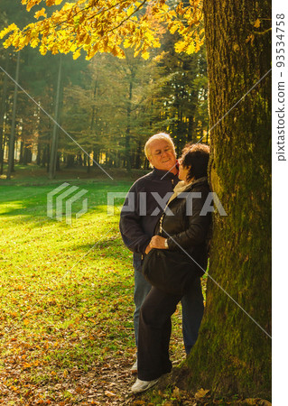Senior couple enjoying time at the park at the sunset. Concerpt Family 93534758
