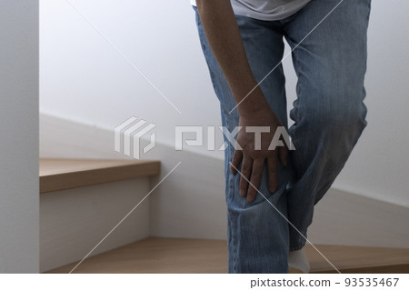 Senior woman holding her knees on the stairs (Japanese, 60s, no face) Senior woman holding her knees on the stairs (Japanese, 60s, no face) 93535467