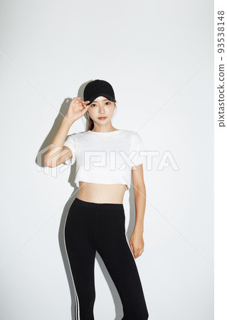 Portrait of young woman in sporty fashion Portrait of young woman in sporty fashion 93538148
