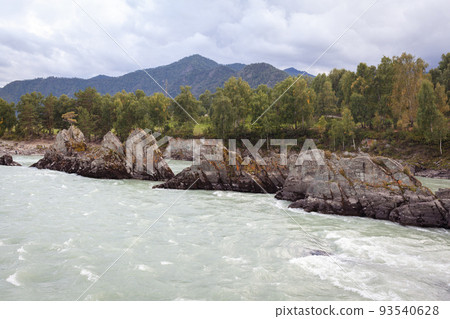 A fast-flowing wide and full-flowing mountain river. 93540628