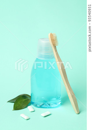 Concept of tooth or oral care on mint background 93540931