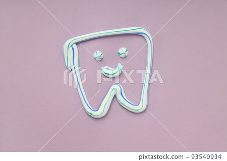 Tooth drawn with toothpaste on a violet background 93540934