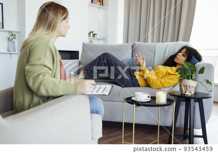 Young african american woman has session with her psychologist. 93543459