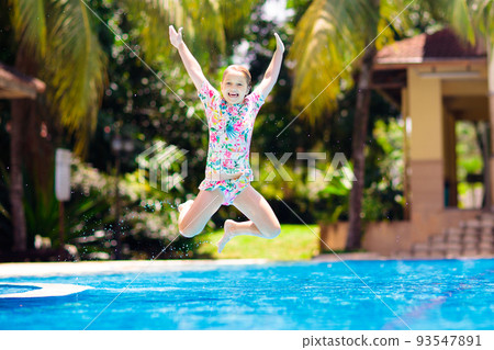 Child in swimming pool. Summer vacation with kids. 93547891