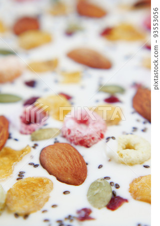 Nut candy in white chocolate on white backgorund Nut candy in white chocolate on white backgorund 93553056