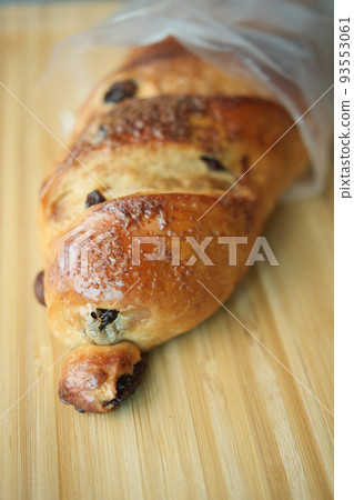 fresh baked brown sugar pillow raisin on table  93553061