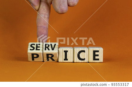 Service price symbol. Hand turns a cube and changes the words 'service' to 'price'. Beautiful orange background. Business and service price concept. Copy space. Service price symbol. Hand turns a cube and changes the words 'service' to 'price'. Beautiful orange background. Business and service price concept. Copy space. 93553317