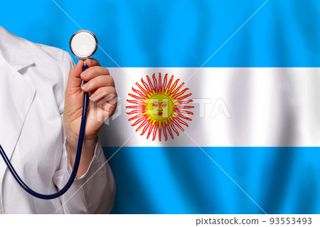 Argentine medical worker's hand with stethoscope on flag of Argentina background Argentine medical worker's hand with stethoscope on flag of Argentina background 93553493
