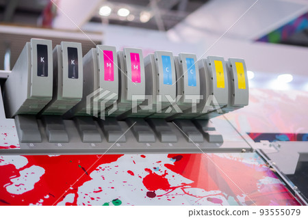 Row of inkjet printer CMYK cartridges - close up 93555079