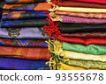 multicolored Indian women's shawls made of silk and cotton in the shop window. 93555678