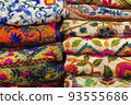multicolored Indian women's shawls made of silk and cotton in the shop window. 93555686